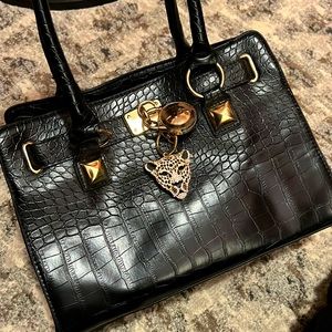 Black Leather purse with gold cheetah piece